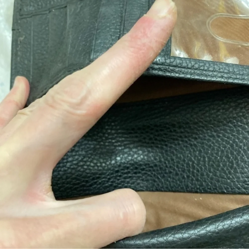 Dooney and Bourke rare perforated black pebbled leather 2 piece wallet set
